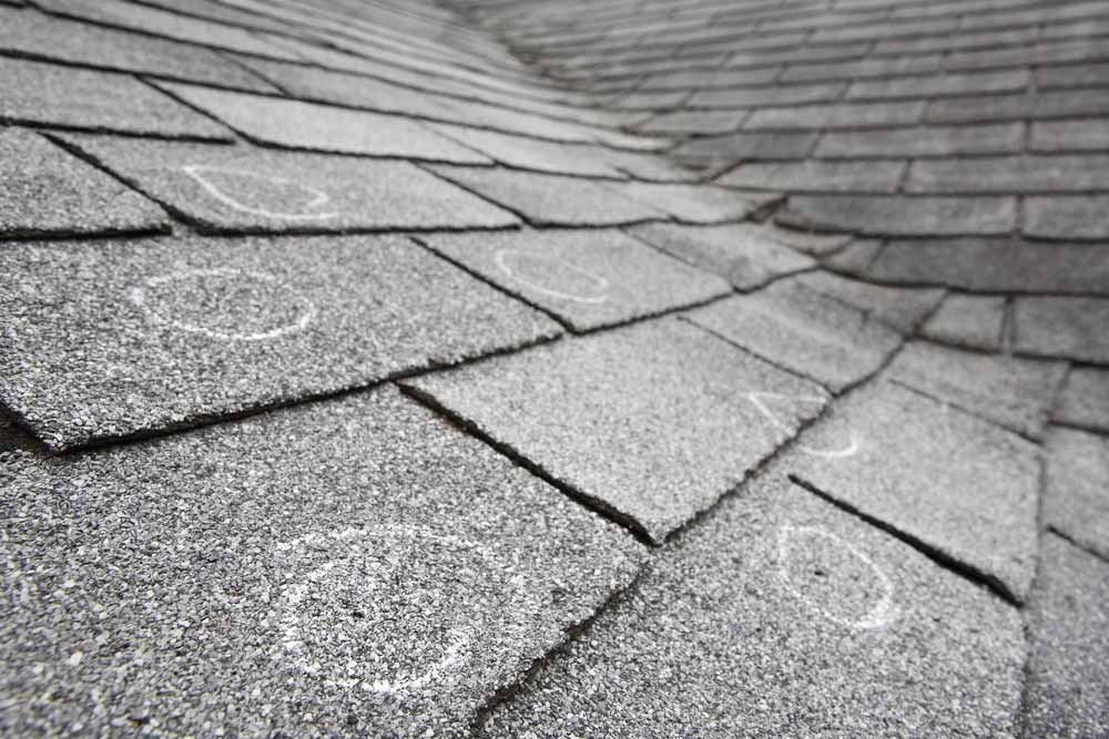 Texas hail storm insurance claims - marks on roof where hail damage is present.